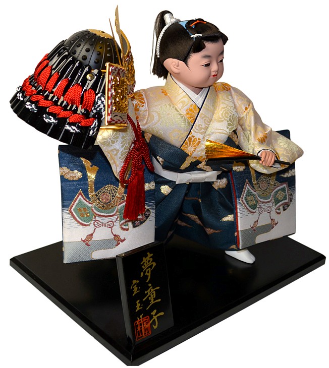 japanese traditional doll of the young samurai with war helmet and fan