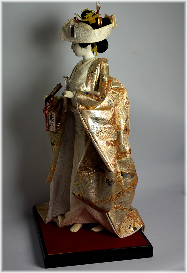 japanese bride doll dressed with silver-gold silk brocaded kimono gown