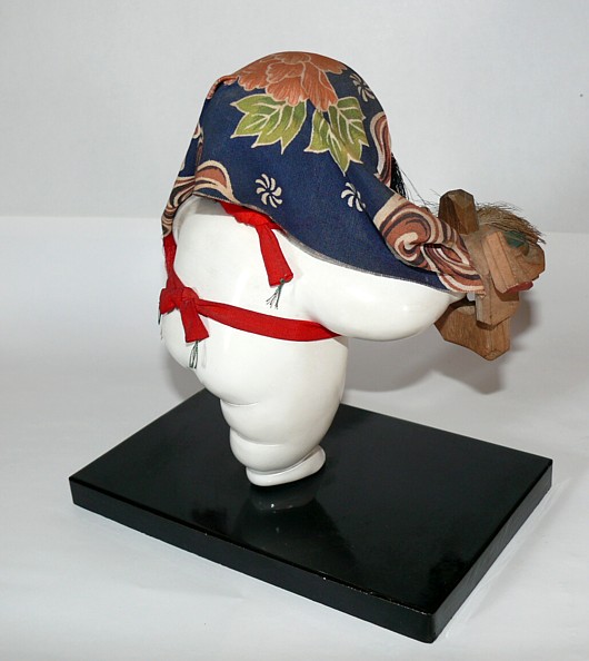 japanese traditional doll of a boy with lion mask