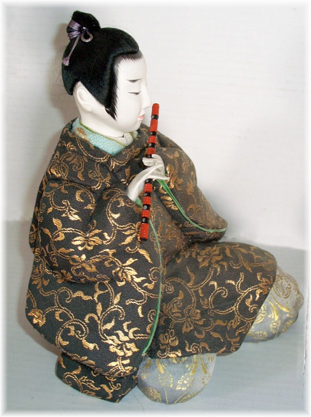 japanese antique kimekomi doll of a man with flute