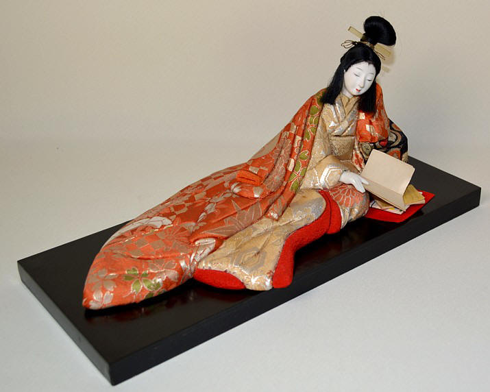 japanese antique kimekomi doll of a lady reading a book