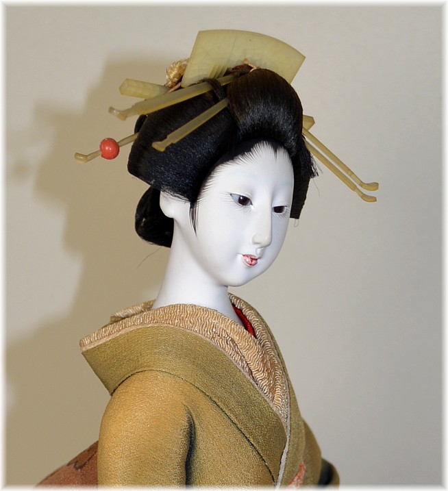 Japanese antique doll of a geisha with umbrella in her hands, early Showa er