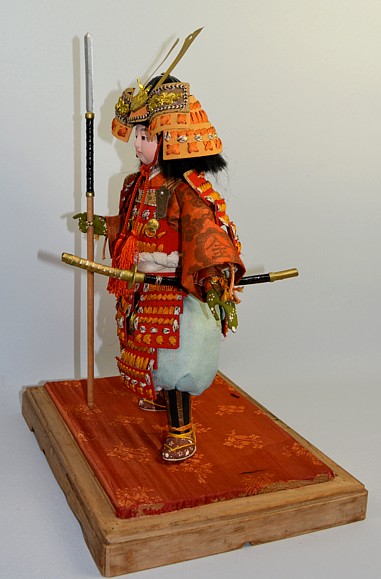 japanese antique doll of a samurai warrior lord with tachi sword