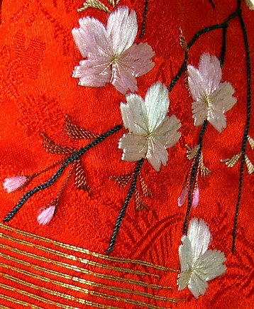 japanese doll's embroided silk kimono detail
