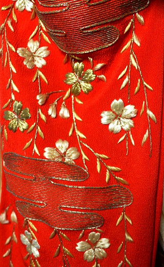 detail of embroidery on the doll's kimono