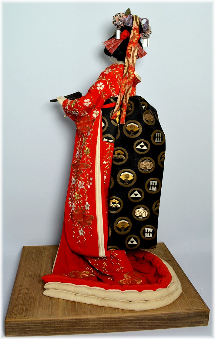 japanese antique doll of a lady with golden high hat