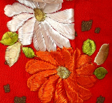 japanese doll's kimono. detail of hand-embroidery