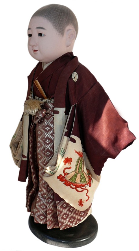 japanese traditional dool of a little boy dressed with formal attire