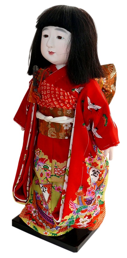 Japanese doll of a little girl in festive attire, 1930's