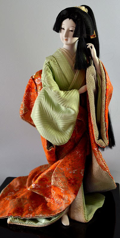 japanese traditional doll of a young long-hair beauty