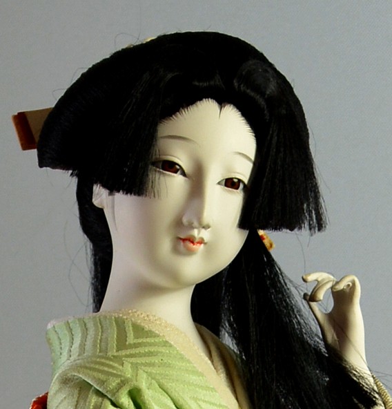 japanese traditional doll of a young long-hair beauty