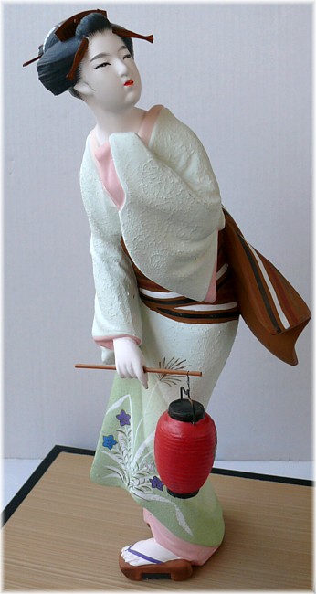 japanese clay figurine of a woman with lantern, 1950's