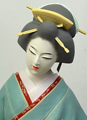 Japanese hakata doll of a dancing  geisha with lfolding fan, 1980's