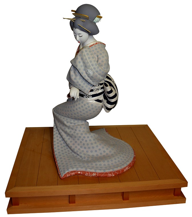 Japanese clay doll of a dancing geisha