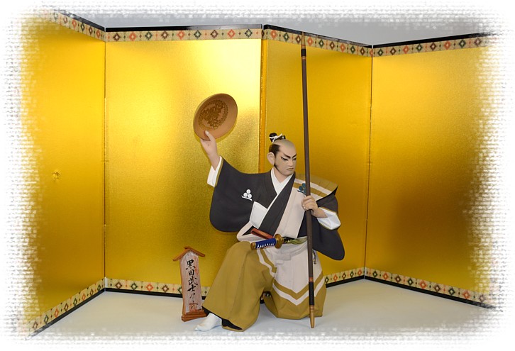 japanese clay doll of the samurai warrior and golden screen
