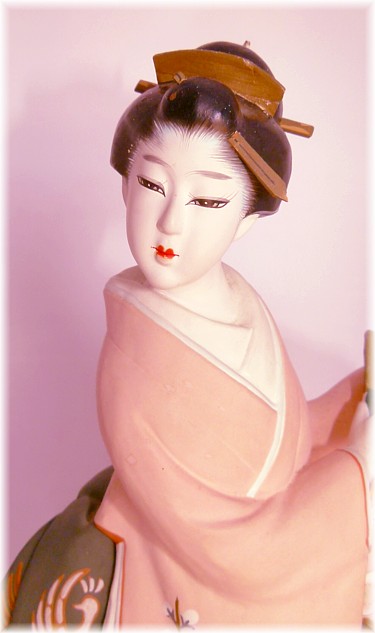 japanese antique hakata doll of a woman  with folding fan