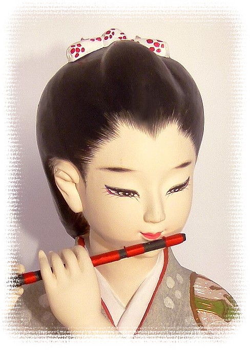 japanese hakata doll with flute