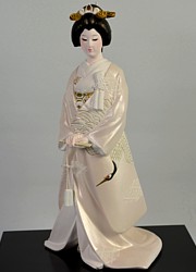 Japanese bride dressed with traditional wedding kimono, ceramic Hakata figurine, vintage