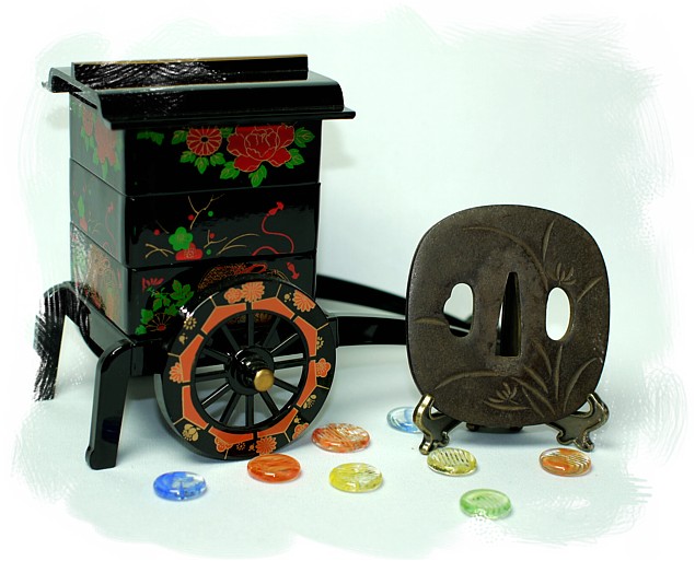 цуба ( гарда японского меча) кованная, резная с изображениме цветка ириса